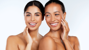 Studio shot of beautiful young women posing against a grey background
