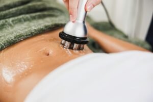 Abdomen treatment with a device and cream