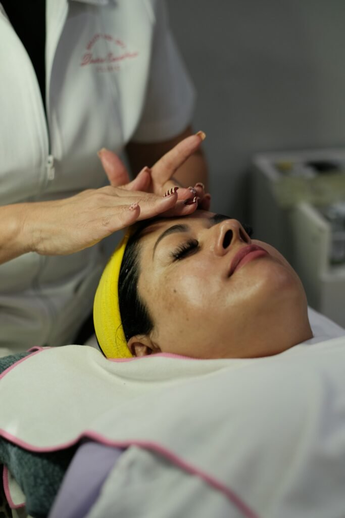 Woman receiving a facial treatment at a spa