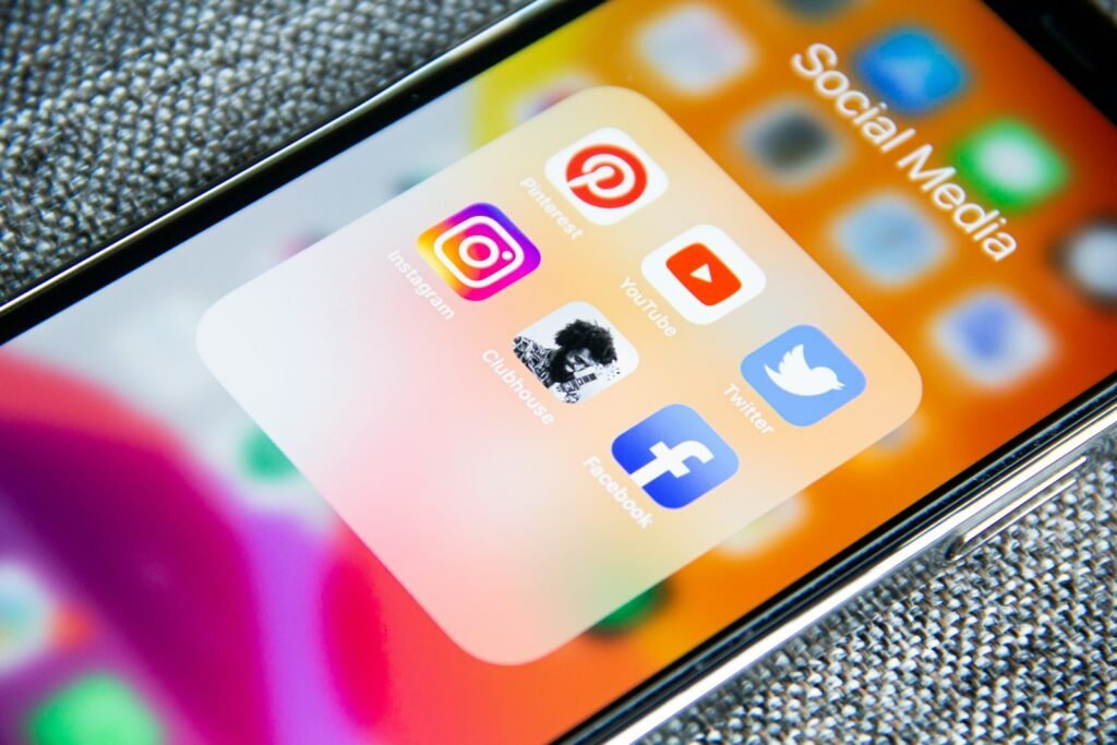 Social media app icons on a phone