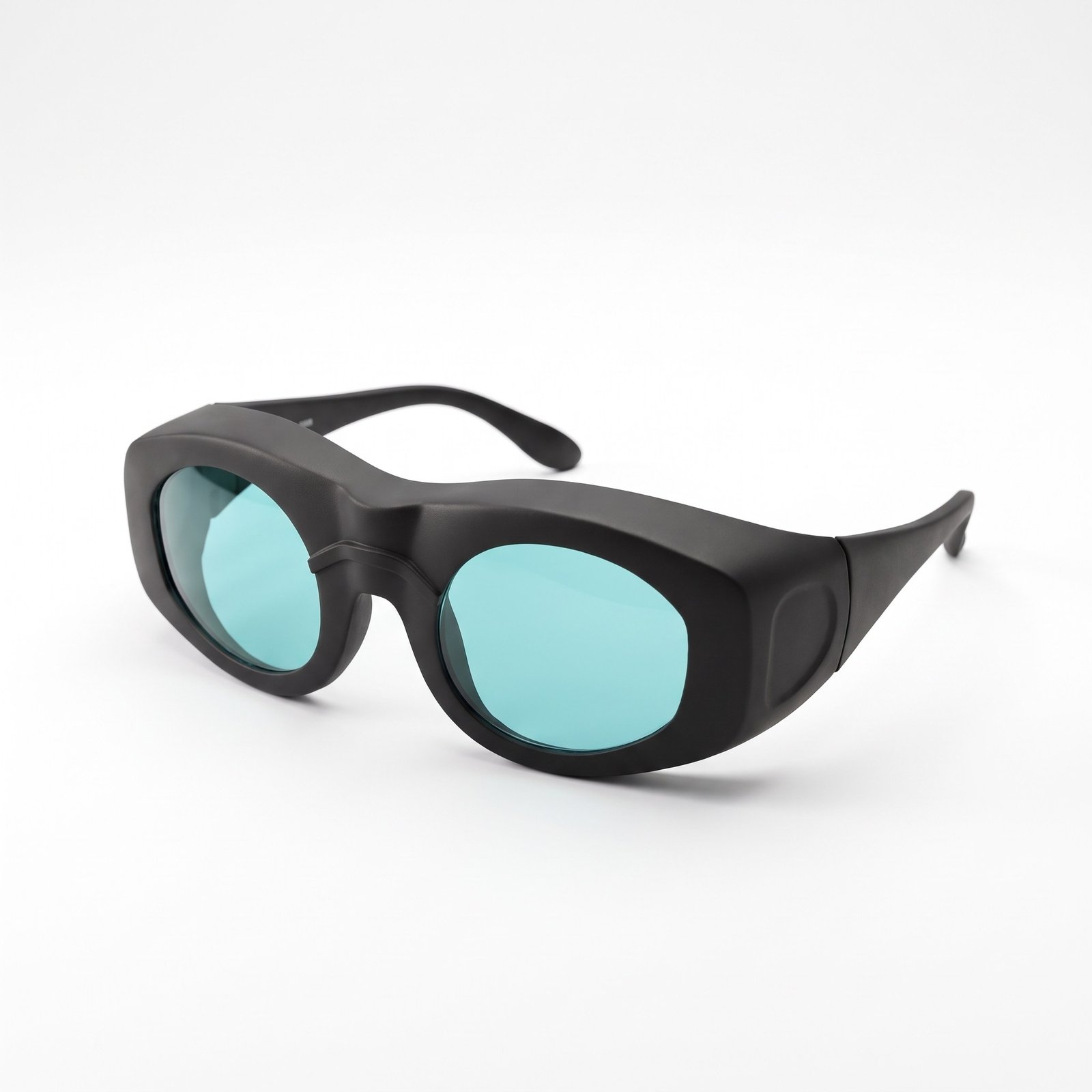 Diode laser safety glasses with turquoise lenses on a white background