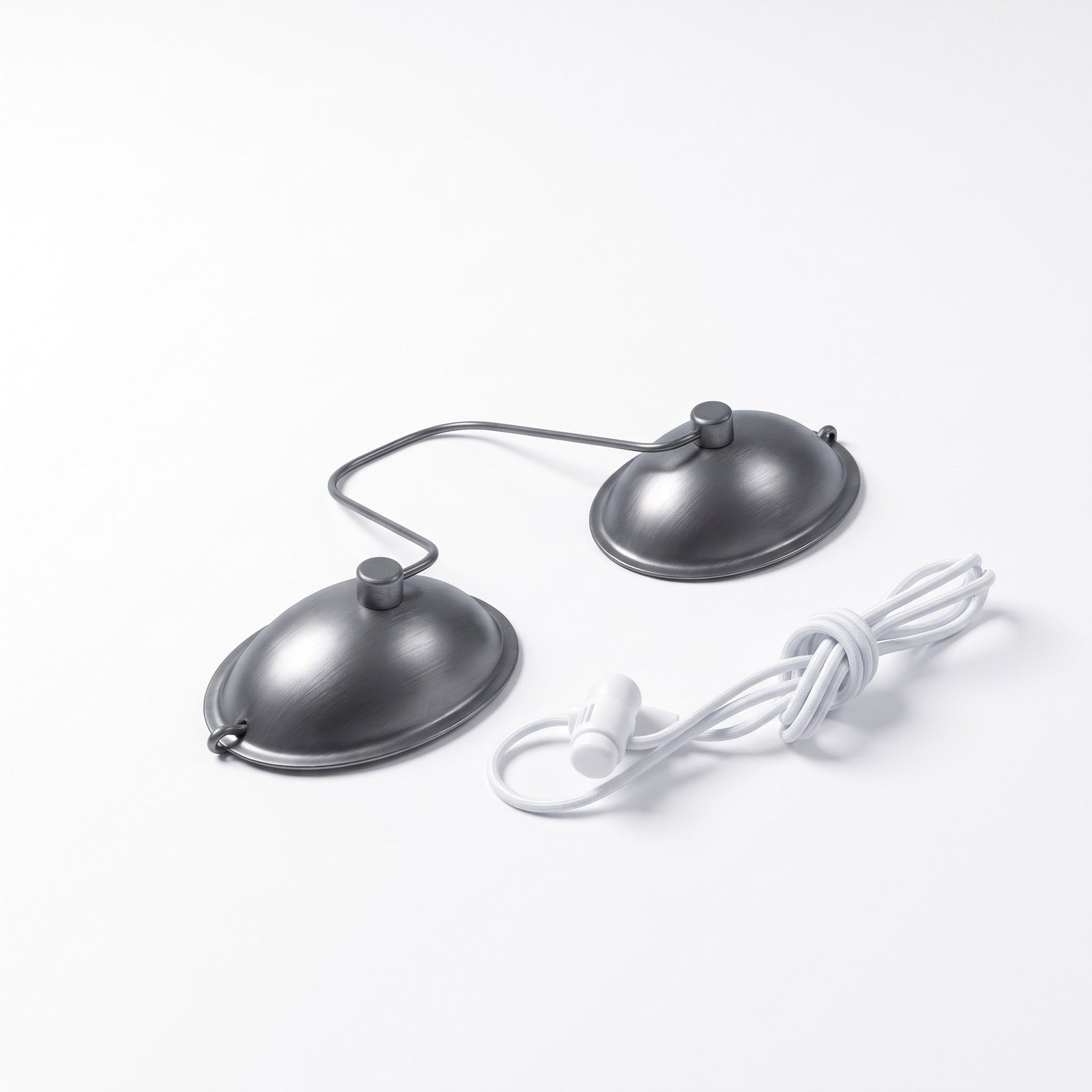 Metal client eye shields with wire bridge and white elastic strap on a white background